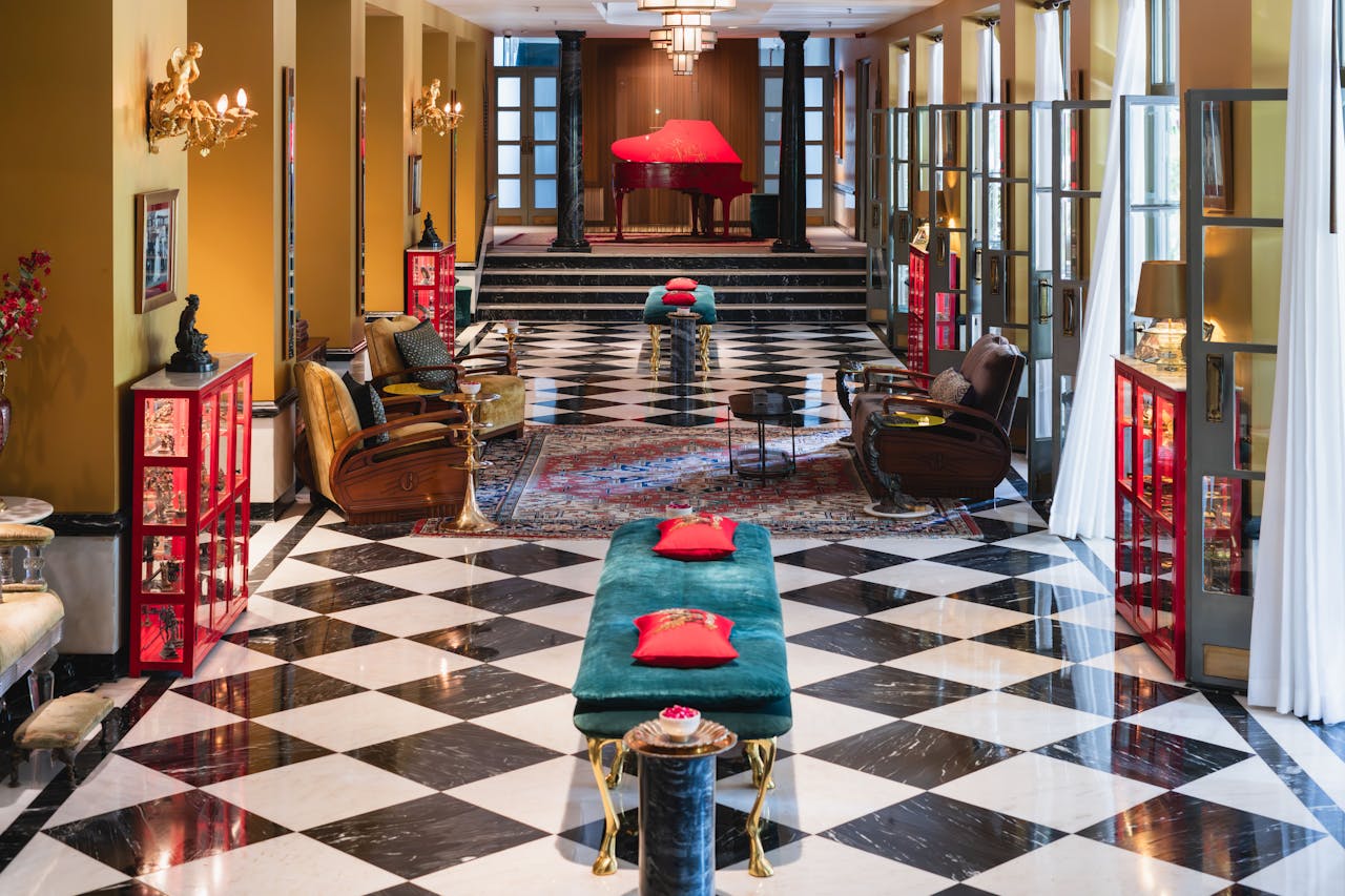 gallery-02 Luxurious hotel lobby in Bikaner, Rajasthan featuring chic interiors and a grand piano.